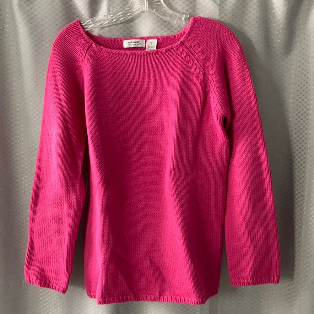 Woman’s pink sweater